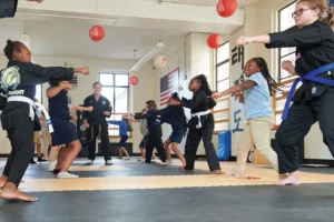 Students at Provident Charter School practice Taekwondo.